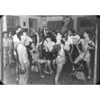 Y.M.-Y.W.H.A. exercise room, Brunswick Avenue, [ca. 1950]. Ontario Jewish Archives, Blankenstein Family Heritage Centre, fonds 61, series 6, item 15.|This item is a glass slide of a group of young men lifting weights in the exercise room of the Y.M.-Y.W.H.A. on Brunswick Avenue. The room is visibly overcrowded.